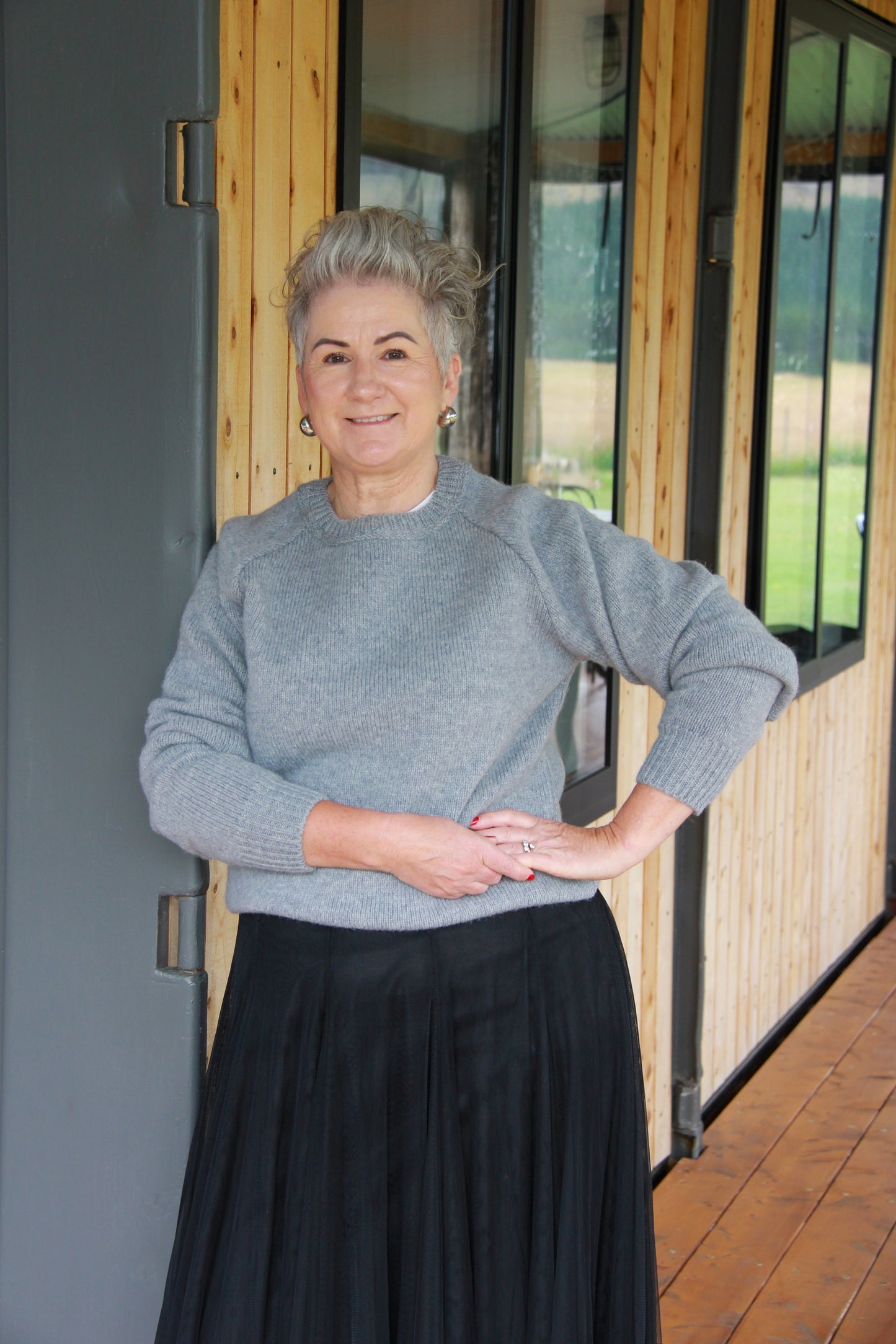 Lady wearing a McIvor Hill Knitted wool sweater in grey