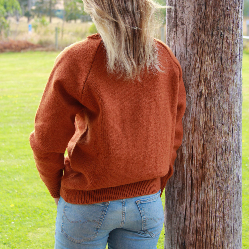 
                      
                        Lady wearing a McIvor Hill knitted wool sweater in grey.
                      
                    